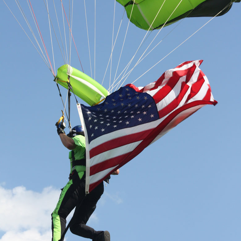 SEAL parachuting flying the American flag
